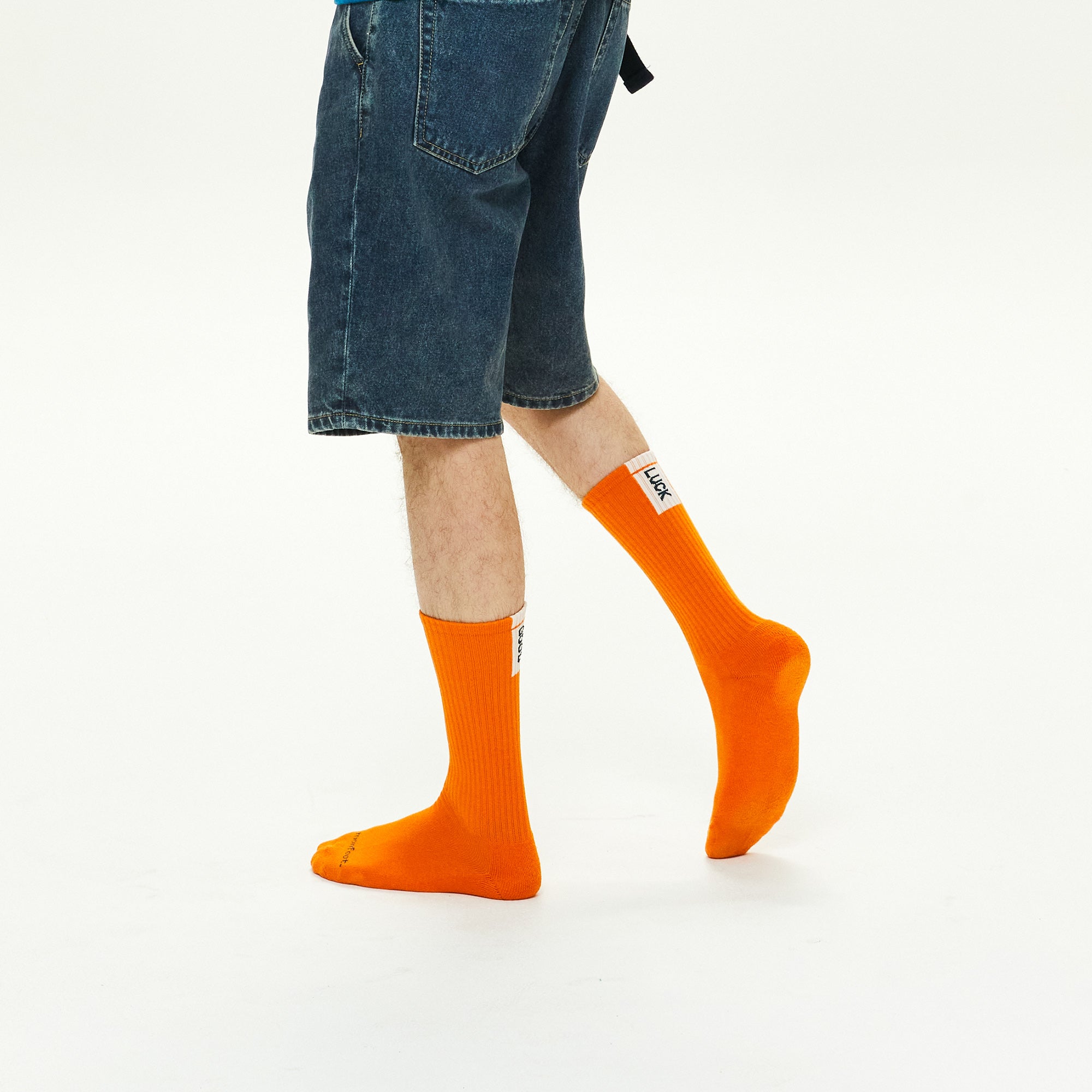 Model wearing Athletic Cushion Good luck Multi Crew 3 Pairs Socks.