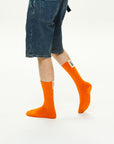 Model wearing Athletic Cushion Good luck Multi Crew 3 Pairs Socks.