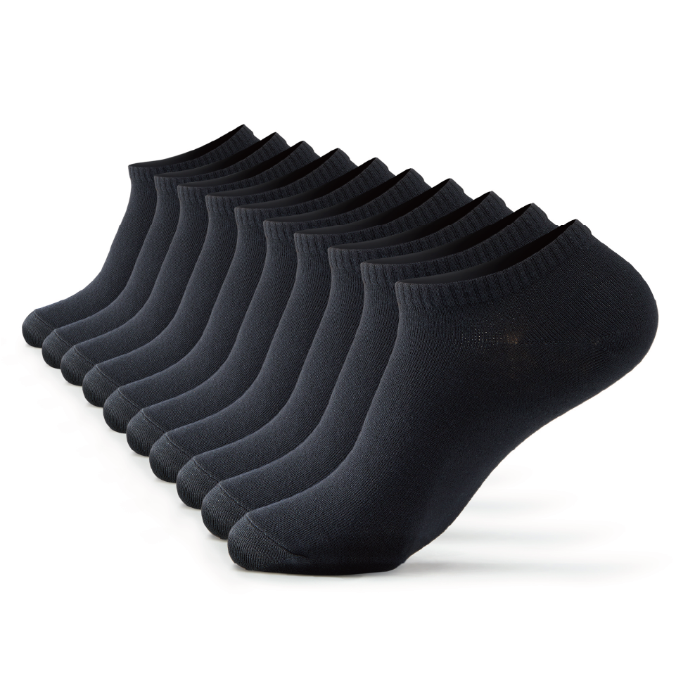 A dozen of black socks sitting on top of each other.