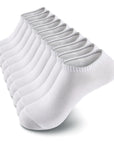 A dozen of white socks sitting on top of each other.