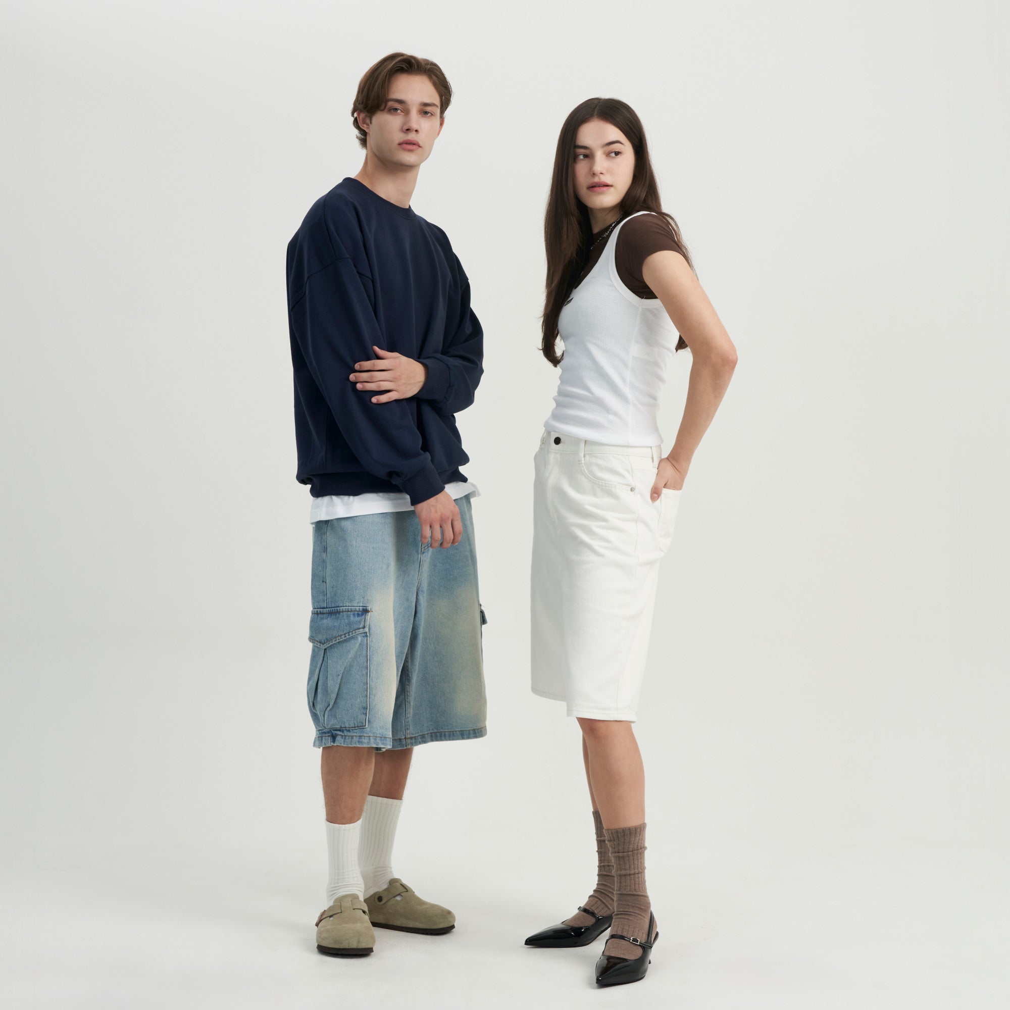 A man and a woman standing next to each other.