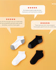 Three pairs of socks sitting next to each other.