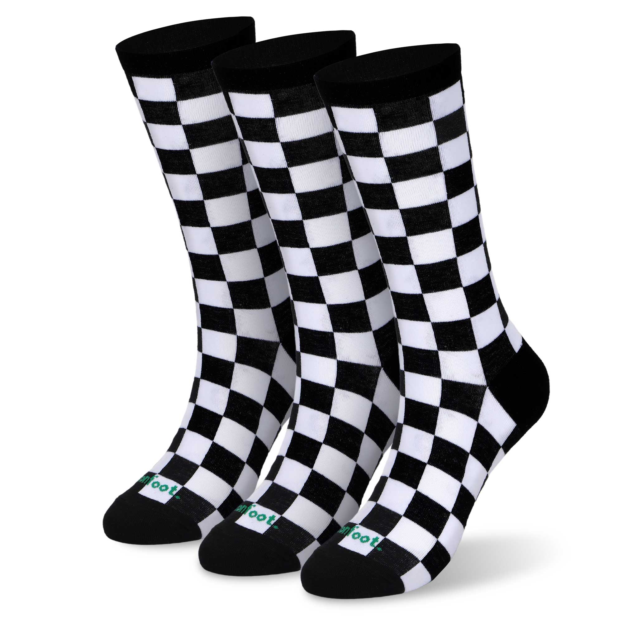 Three pair of black and white and red socks.