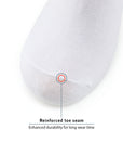 A white pillow with a red dot on it.