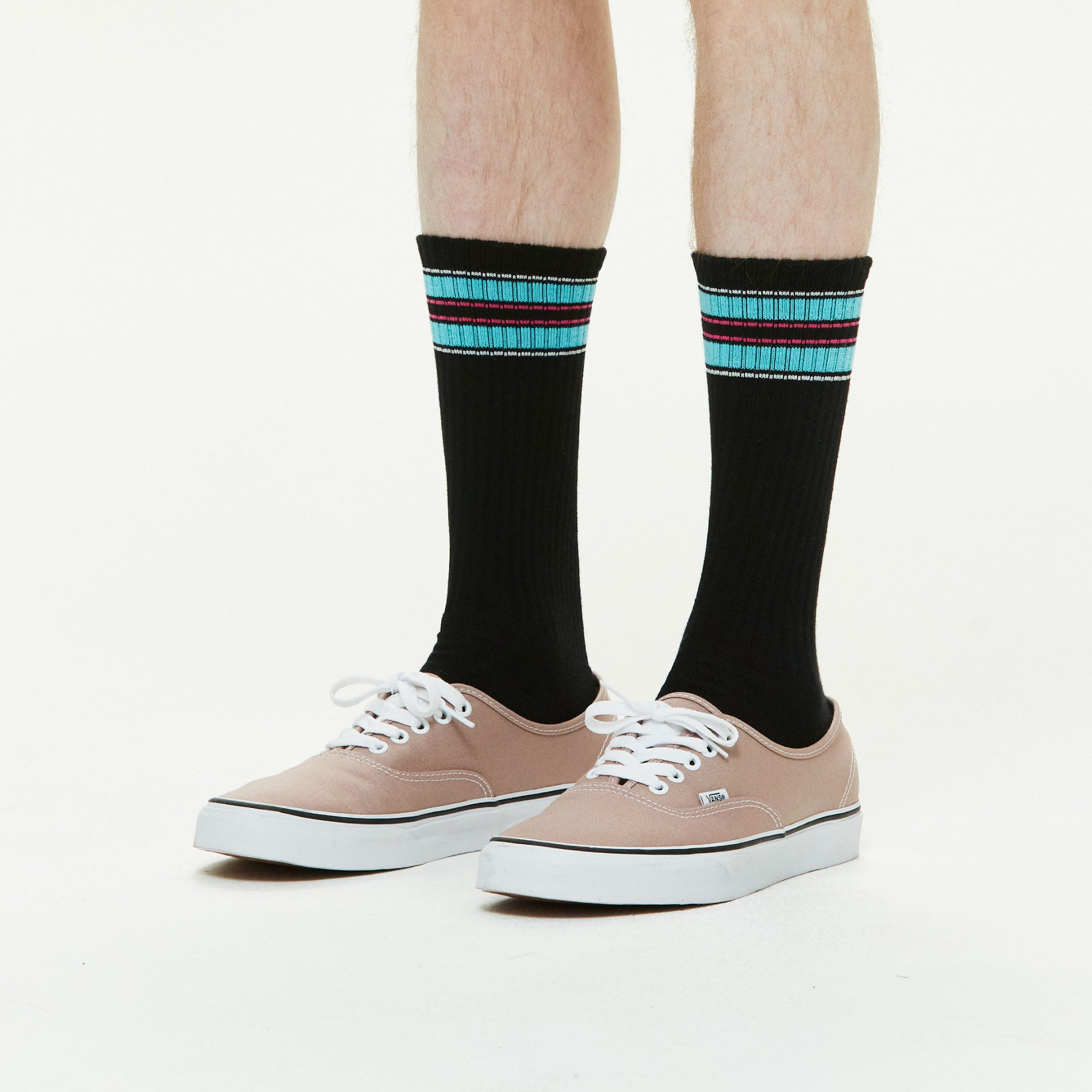 Model wearing Athletic Cushion Double Stripes Crew 3 Pairs Socks.