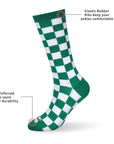 A green and white checkered sock with information.