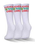 Three pair of white and red and green socks.