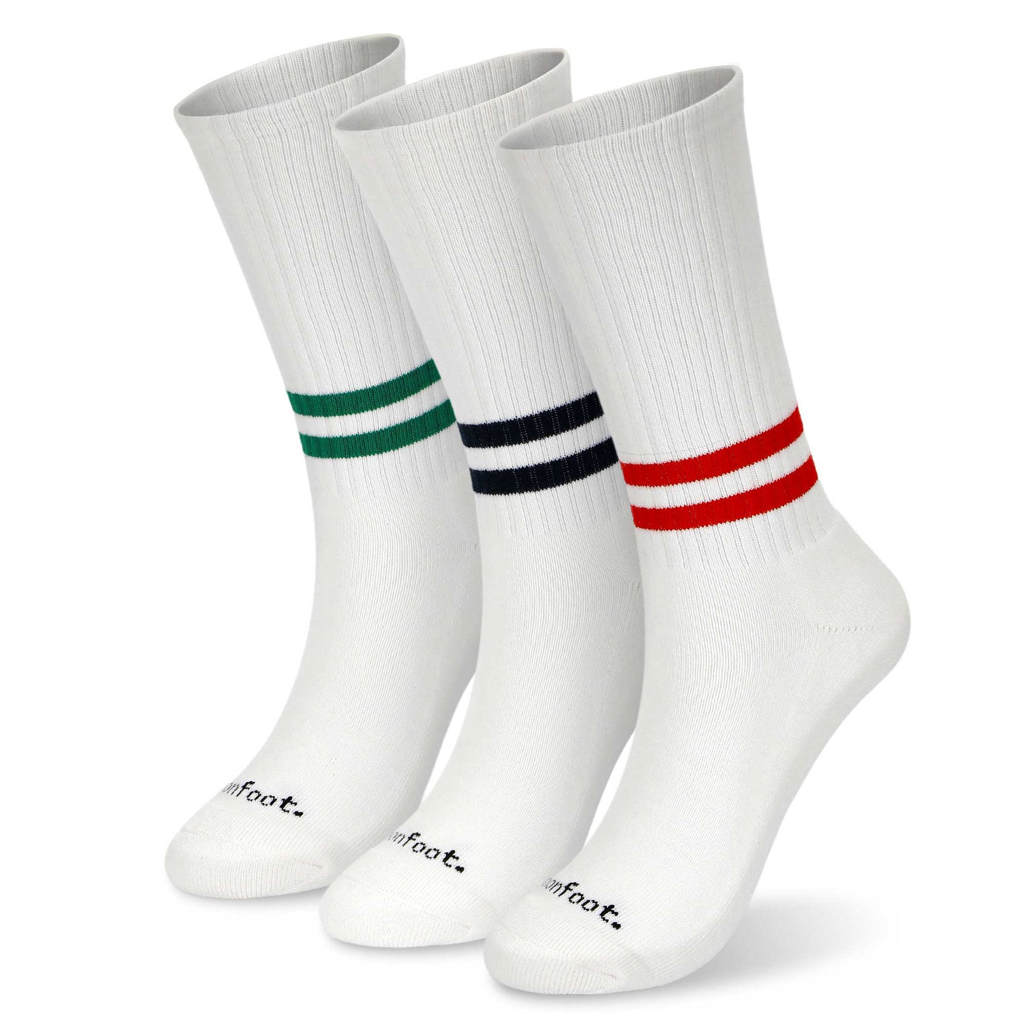 Three pair of white and red and blue and green socks.