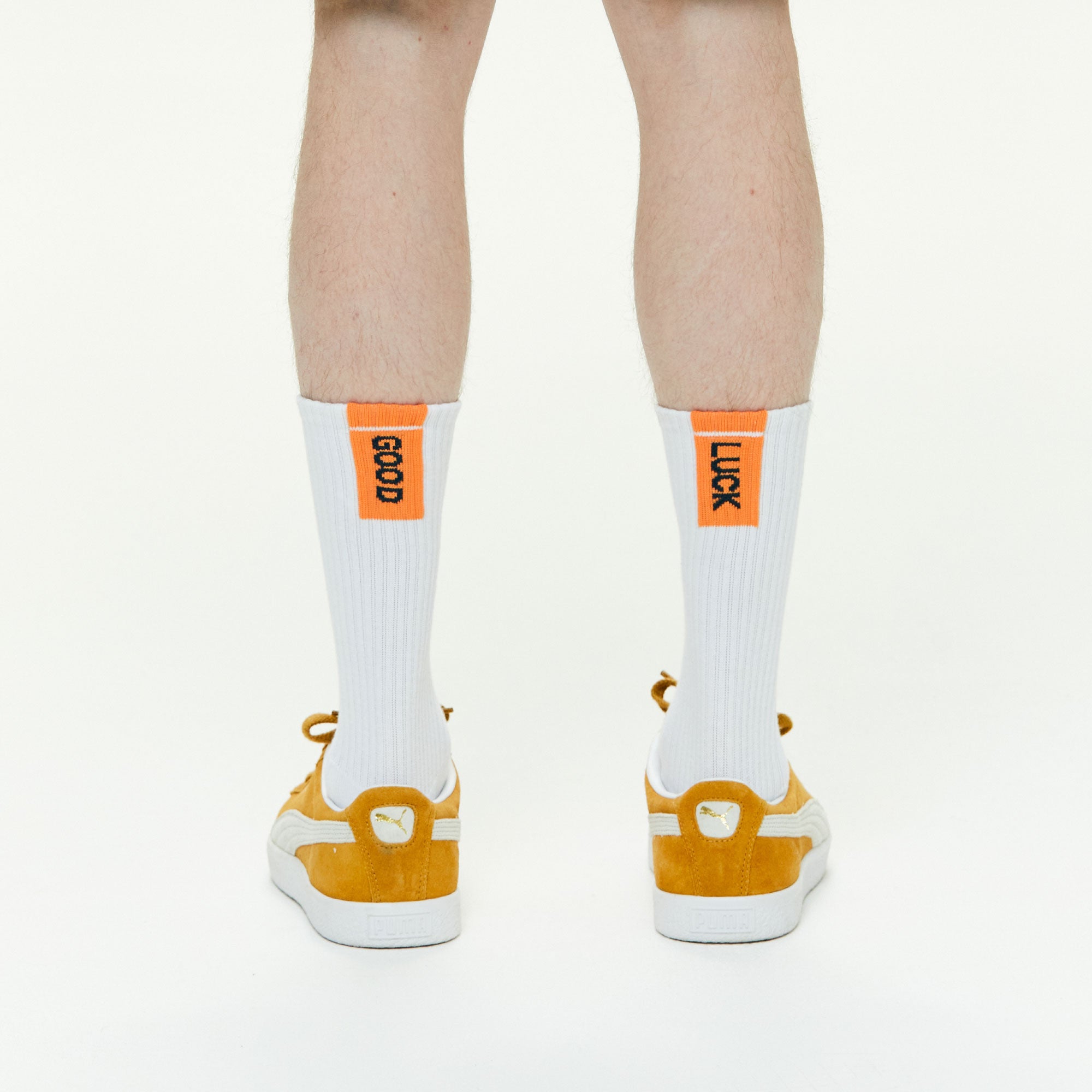 Model wearing Athletic Cushion Good luck Multi Crew 3 Pairs Socks.