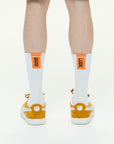 Model wearing Athletic Cushion Good luck Multi Crew 3 Pairs Socks.