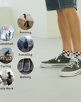 A person standing on a white floor wearing green sneakers.