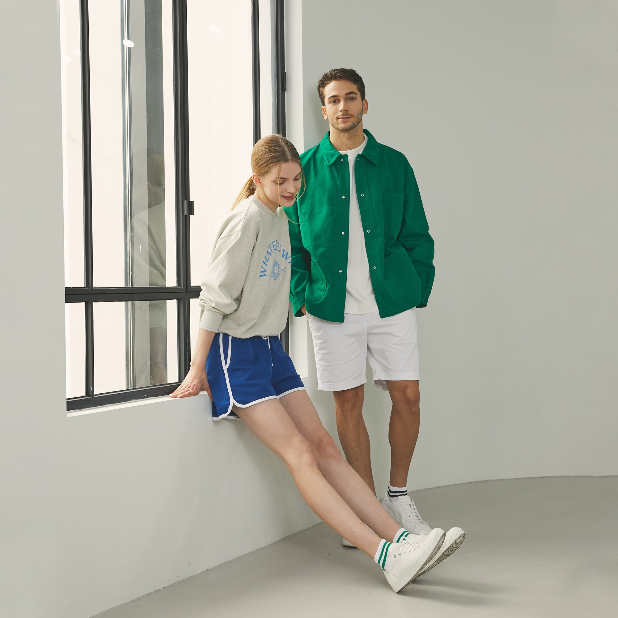 A man and a woman standing next to each other.