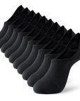 A dozen of black socks sitting on top of each other.
