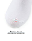 A white pillow with a red dot on it.