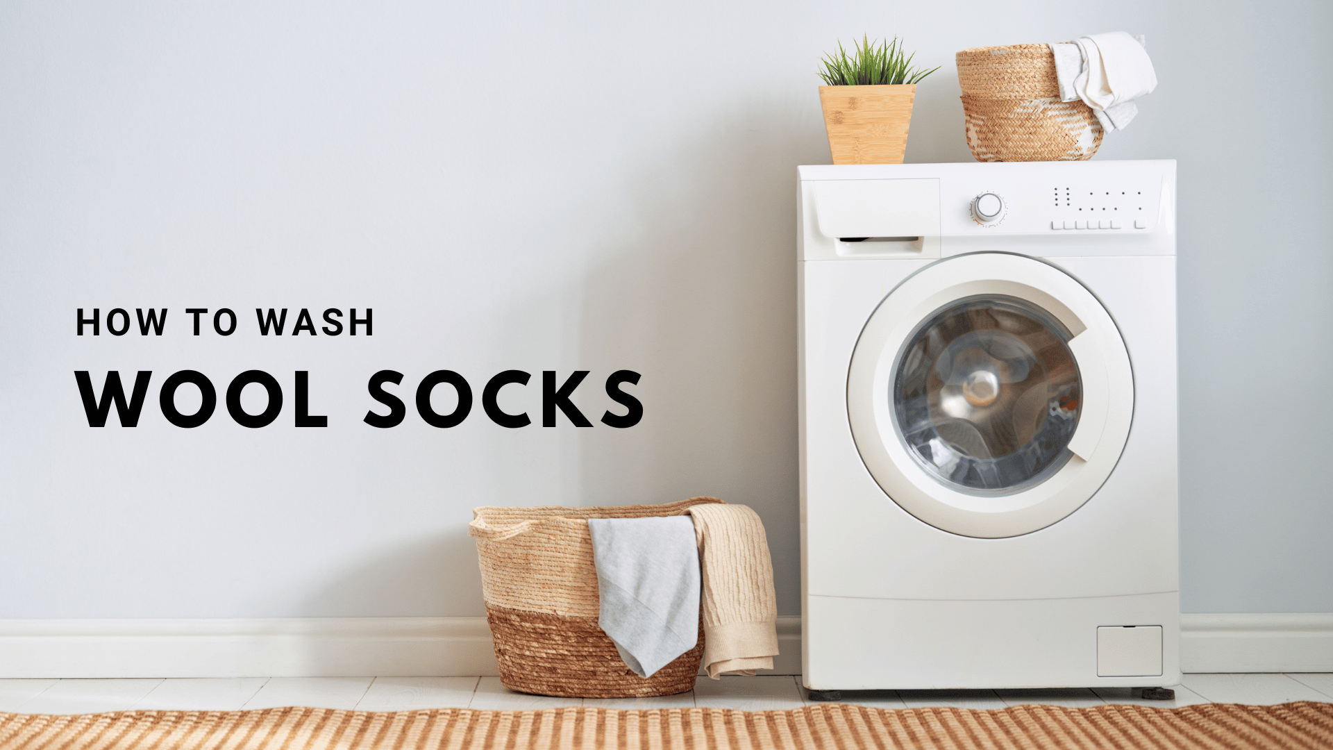 Laundry setup with a white front-load washing machine, a wicker laundry basket with wool socks draped over the edge, and text that reads "How to Wash Wool Socks" on the left side of the image.