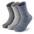 Three pairs of socks with fuzzy socks on them.
