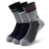 Three pairs of men's socks with different colors.