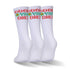 Three pair of white and red and green socks.
